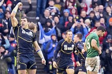Scotland's backs celebrate victory over Ireland - © Alastair Ross