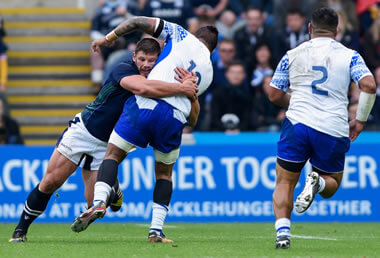 Ross Ford tackles a Samoan - pic © Al Ross