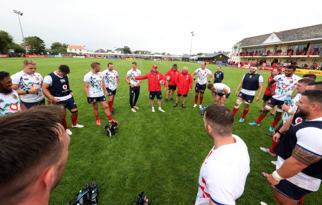 Lions players in a circle after a training session
